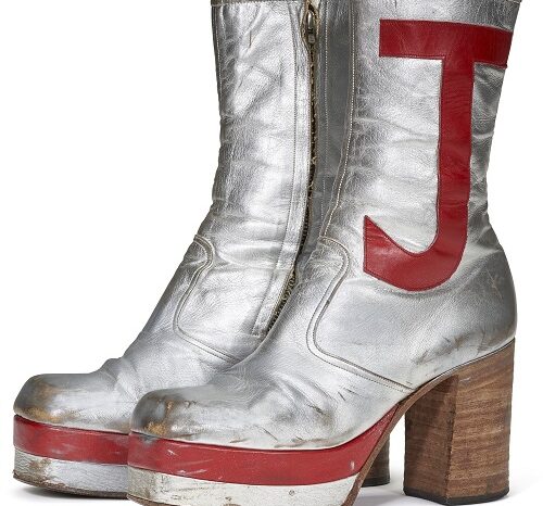 A PAIR OF SILVER LEATHER TALL PLATFORM BOOTS, CIRCA 1971