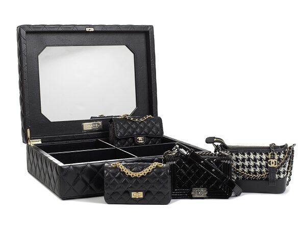 A rare Chanel_ a success story set of four classic black micro mini bags and trunk, estimate £15,000 20,000
